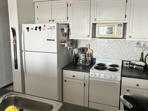 Microwave, dishwasher, coffee/tea maker, cookware/dishes/utensils