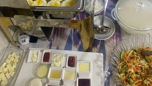A buffet with various food items including eggs, meats, and salads. - BARHAT HOTEL (Tashkent)