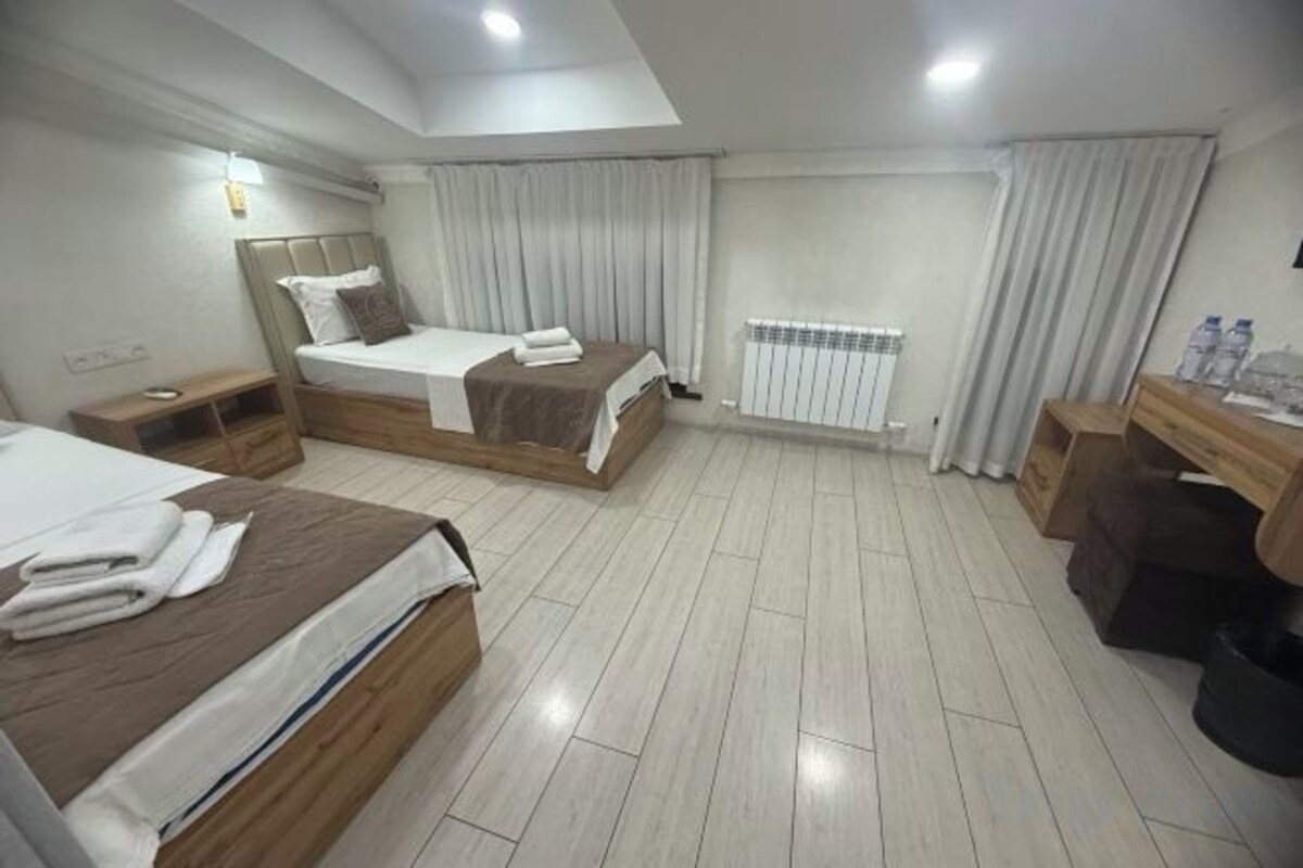 Premium bedding, desk, blackout drapes, iron/ironing board (on request)