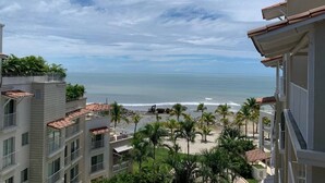 A beachfront hotel with multiple balconies overlooking the ocean. - Charming Beachfront 3BR in Puntarena (Río Hato)