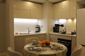 GR1 Block Garden Apartment | Private kitchen | Full-size fridge, microwave, oven, stovetop