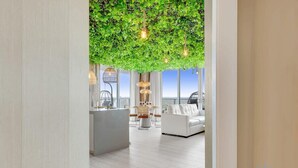 A modern interior with a living area, a dining space, and a kitchen. - Skyline Views 2BR w/ Pool Hollywood (Hollywood)