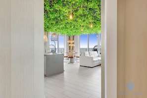 A modern interior with a living area, a dining space, and a kitchen.