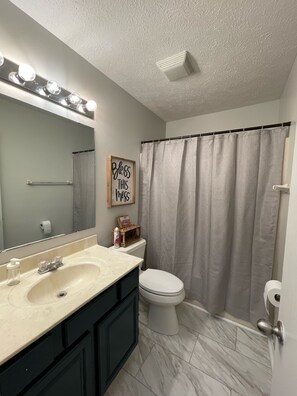 Combined shower/tub, towels, soap, toilet paper