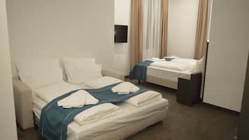 Premium bedding, down duvets, in-room safe, desk