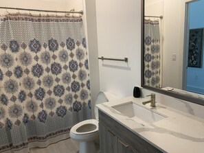 Combined shower/tub, toilet paper