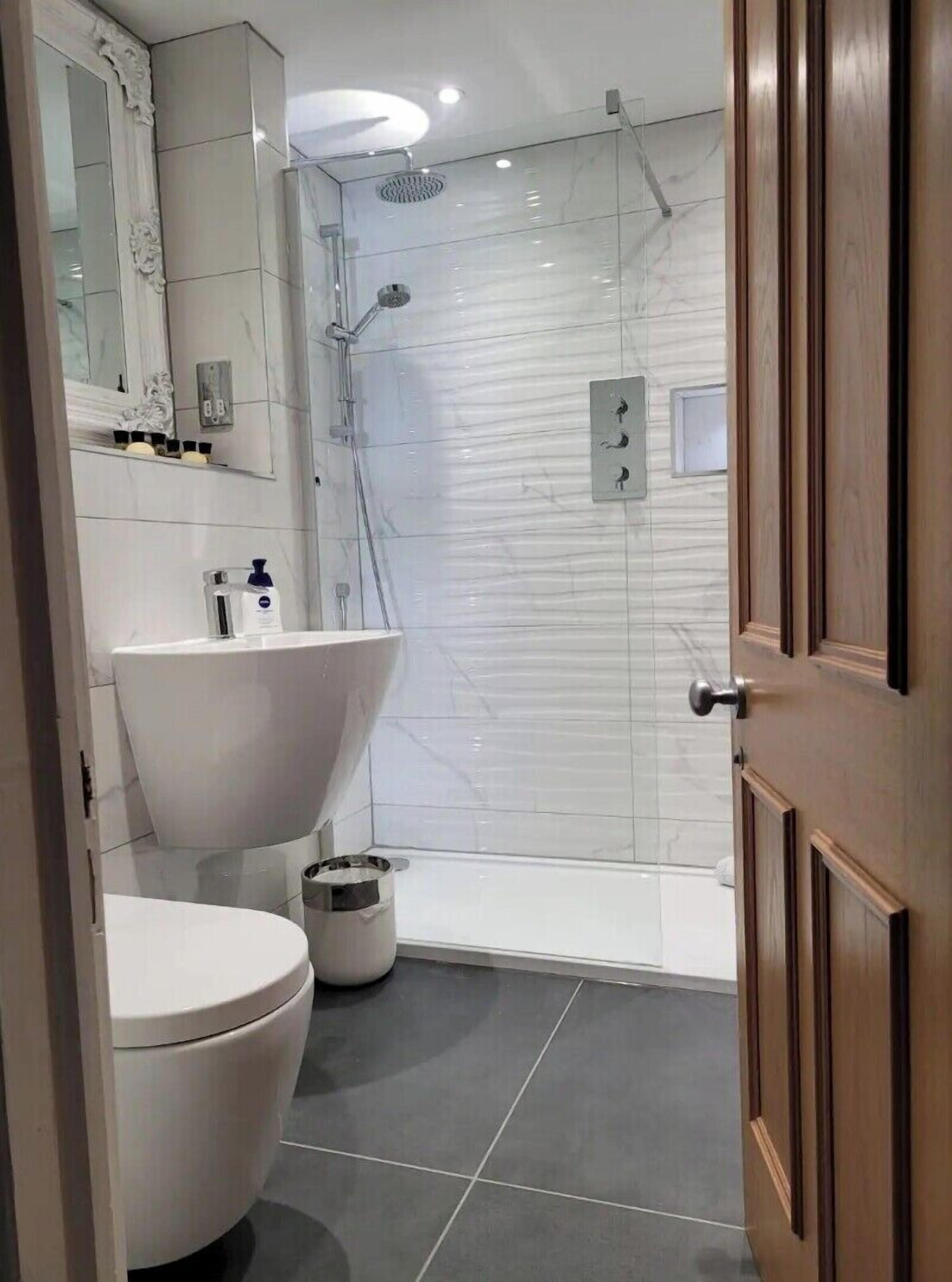 Bathtub, hair dryer, towels, soap