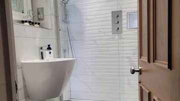 Bathtub, hair dryer, towels, soap