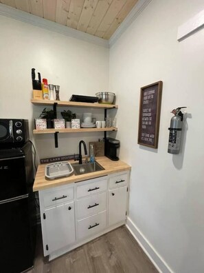 Fridge, microwave, coffee/tea maker, toaster