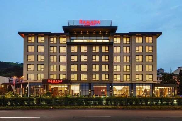 A multi-story hotel with a prominent "RAMADA" sign at the top. - Ramada by Wyndham Rize Findikli (Findikli)