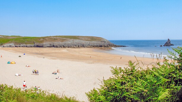 A beach with tents and people. - 2 bedroom accommodation in Landshipping, near Narberth (Landshipping, near Narberth)