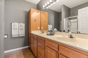 Combined shower/tub, hair dryer, towels, soap