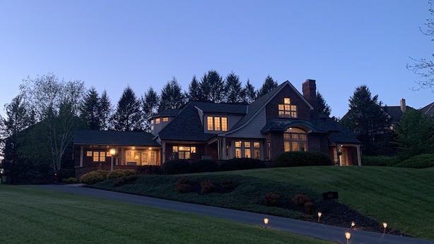A large, two-story house with a well-maintained lawn and a driveway. - Nearly 6000 sq ft of luxury living only 3 mi from PSU stadium (State College)