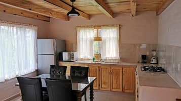 Family Cabin, 3 Bedrooms | Private kitchen | Fridge, microwave, dining tables