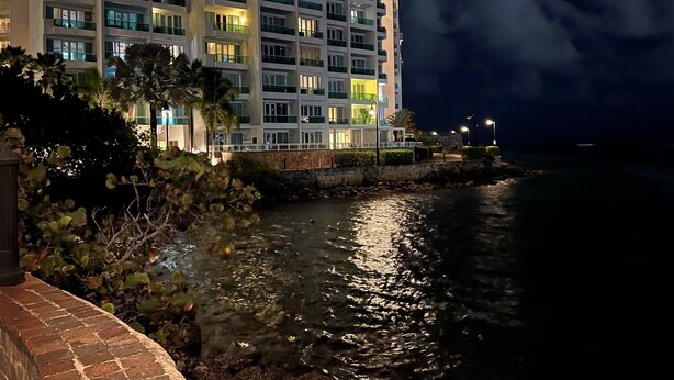 A multi-story hotel with balconies, a waterfront view, and a stone retaining wall. - Condado Lagoon Villas/Connected Bayfront Studios w/views, kitchen/washer/dryer (San Juan)