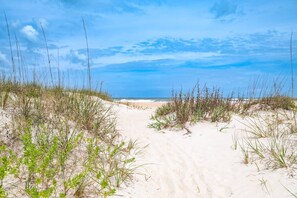 A sandy beach path leading to the ocean with dunes on either side. - Endless Summer on B Street - Unit B (St. Augustine)