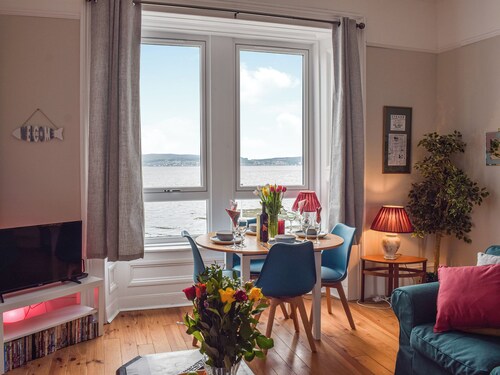 A spacious apartment with stunning views over Gare Loch.
