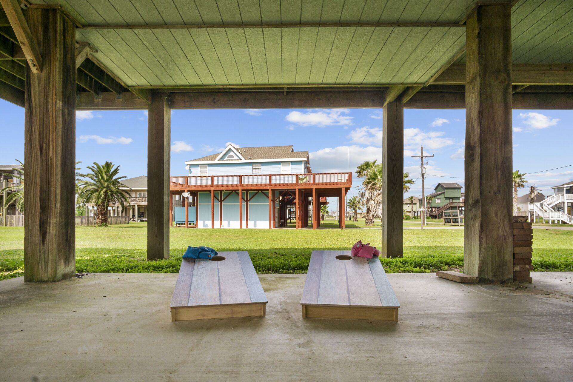 A covered outdoor area with two wooden benches.