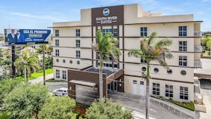 A hotel with a sign reading "South River Suites". - South River Suites (Miami)