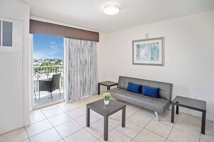 Deluxe Suite, 2 Bedrooms | Living room | 42-inch flat-screen TV with cable channels, TV, Netflix