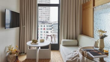 City Suite, City View | Living area | 42-inch Smart TV with digital channels, TV