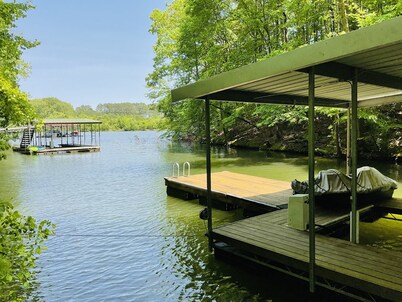Family friendly lake front home with private dock in a cove