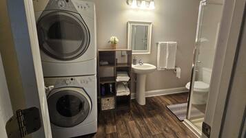 Combined shower/tub, hair dryer, towels, soap