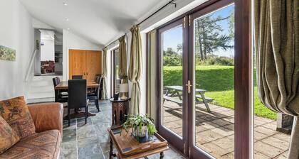 Spacious Teifi Valley barn for holidays near the Cardigan coast.