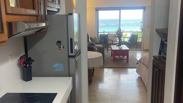 Fridge, microwave, stovetop, coffee/tea maker