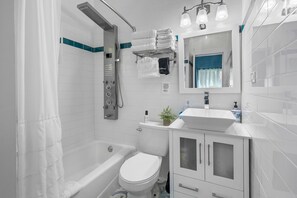 Combined shower/bathtub, hair dryer, towels, soap
