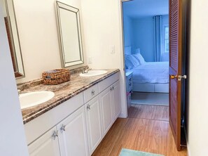 Shower, hair dryer, towels - Sea Shell Room — Bright Coastal Luxury with Extra Space to Unwind (Rehoboth Beach)