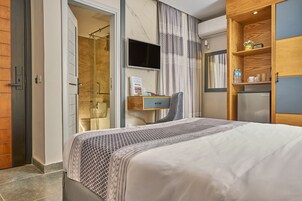 Habitación económica | Ropa de cama de alta calidad y edredones de plumas