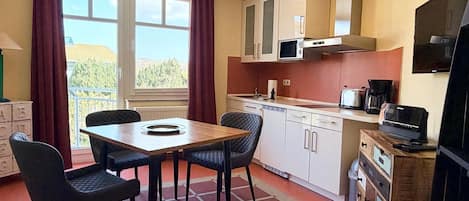 Fridge, microwave, stovetop, coffee/tea maker