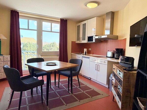 Fridge, microwave, stovetop, coffee/tea maker