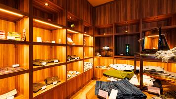 A wooden interior with shelves displaying various items.