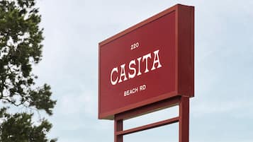A red sign with the text "CASITA BEACH RD 220".