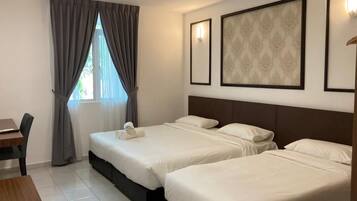 Down duvets, desk, laptop workspace, bed sheets