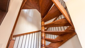 A wooden spiral staircase with a handrail and a metal railing. - Harbour Views Gozitan Villa + Shared Pool, Mġarr Gozo, Malta (Mġarr Gozo)