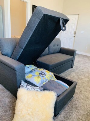 Relax in comfort on the adjustable sofa with a matching ottoman.