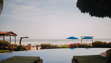 Outdoor pool, pool umbrellas, sun loungers