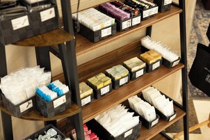 A shelf with various toiletries and personal care items.