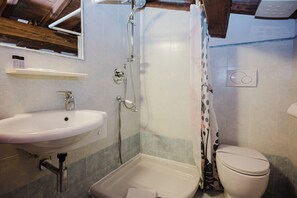 A bathroom with a sink, shower, and toilet. - Condotta - Two Bedroom Apartment, Sleeps 3 (Firenze)