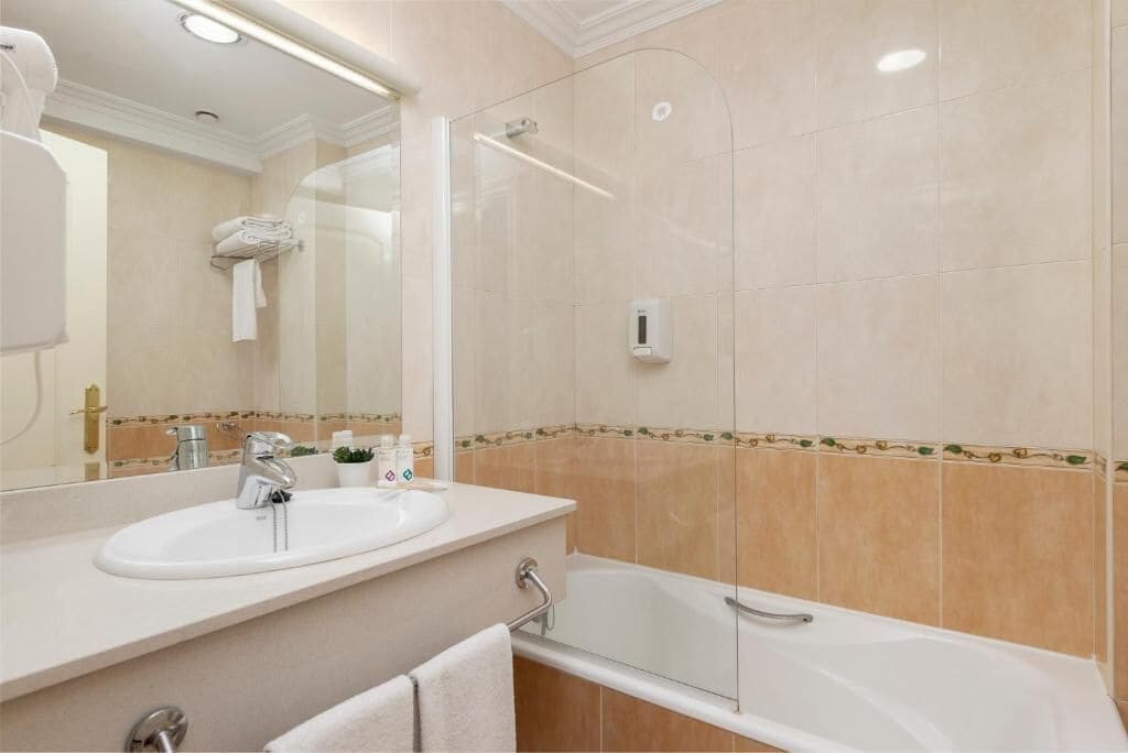 combined shower/bathtub, hair dryer, towels, soap