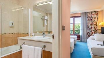 Combined shower/tub, hair dryer, towels, soap