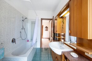 Bathtub, hair dryer, towels