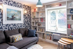 TV, fireplace, books