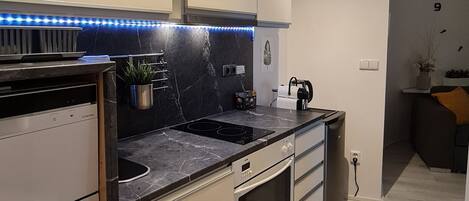 Apartamento urbano, 1 quarto, cozinha americana | Cozinha privada