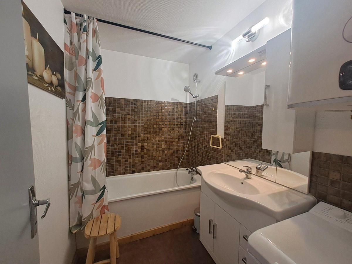 A bathroom with a bathtub, a sink, and a shower.