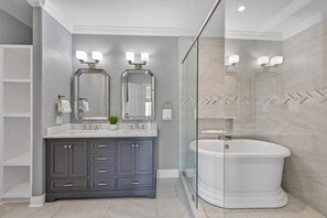 Bathtub, eco-friendly toiletries, hair dryer, towels