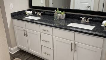 Combined shower/tub, hair dryer, towels, soap